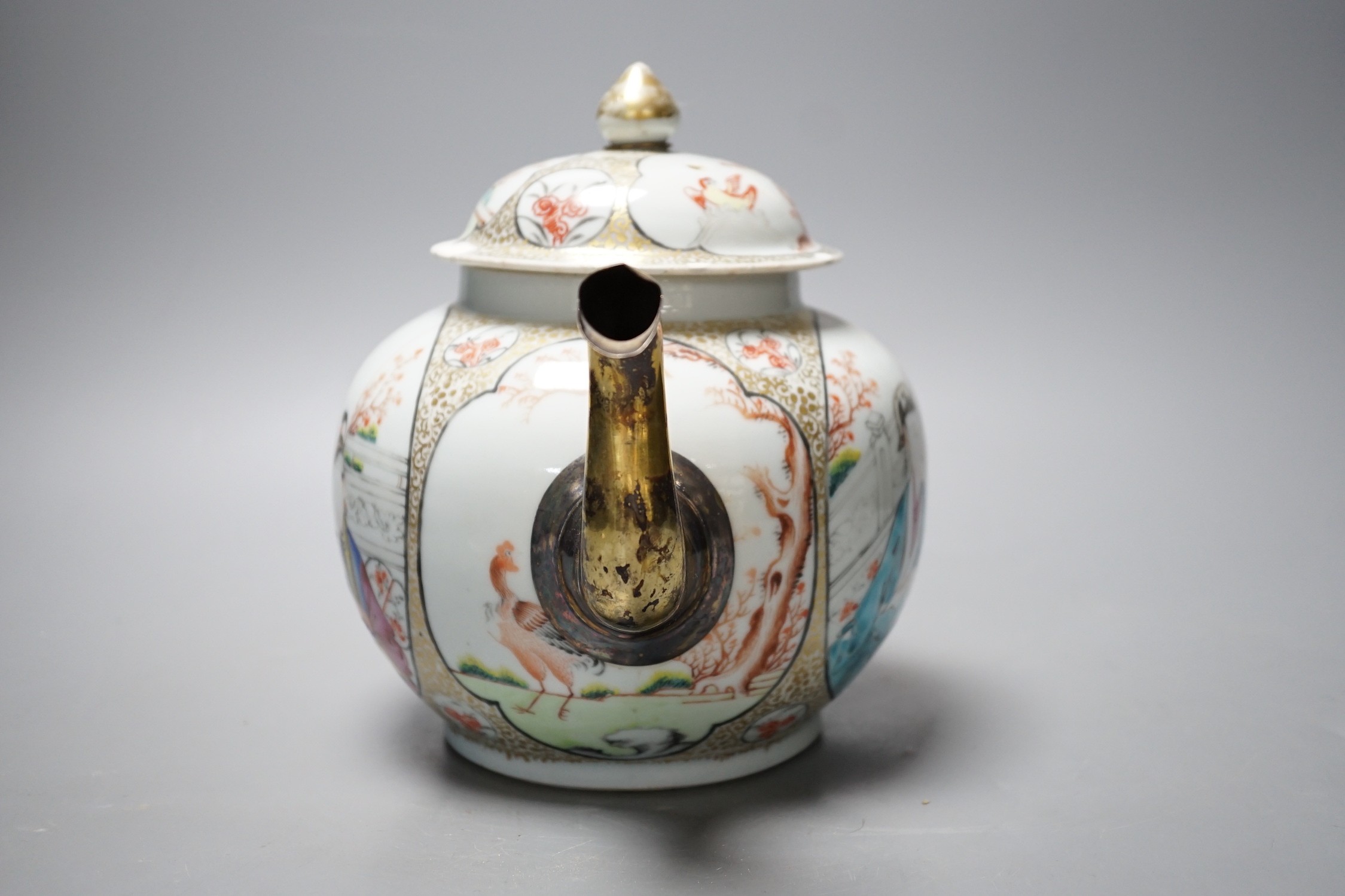 A large Chinese famille rose fencai teapot and cover, Qianlong period, replacement gilt metal spout, cover with restored chips, 20cm tall